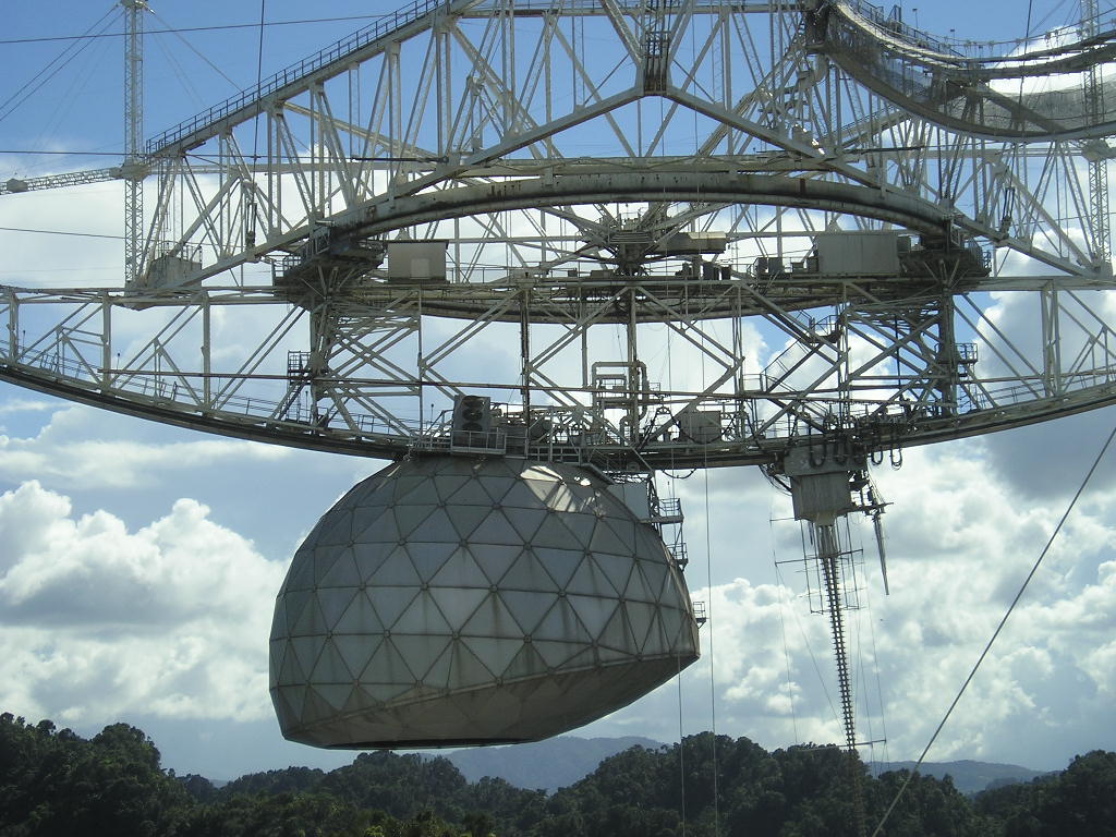 Gregorian dome and feed antenna suspended above Arecibo’s reflector