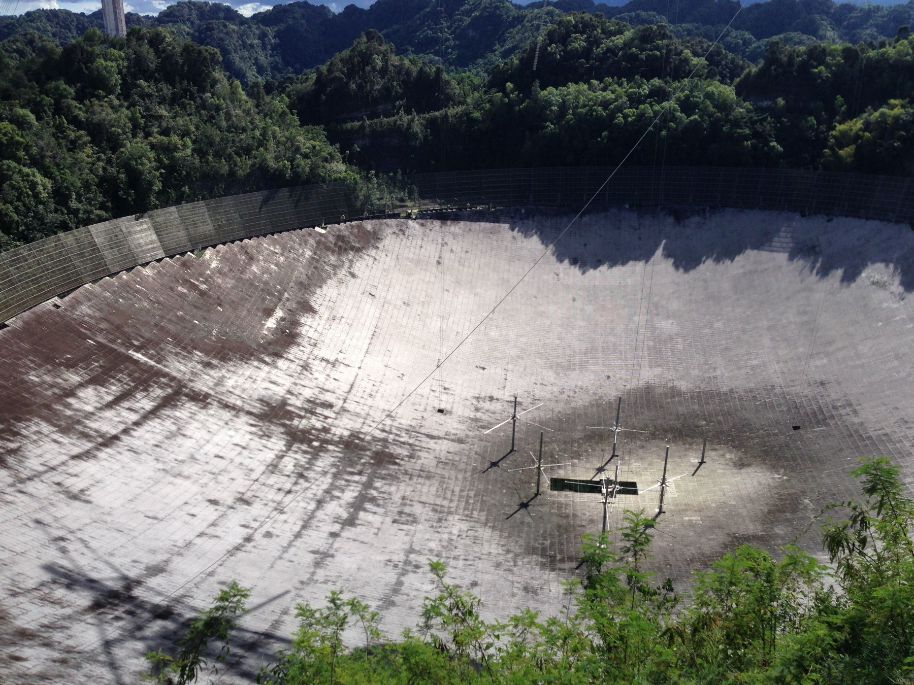 The 305-metre reflector of the Arecibo radio telescope