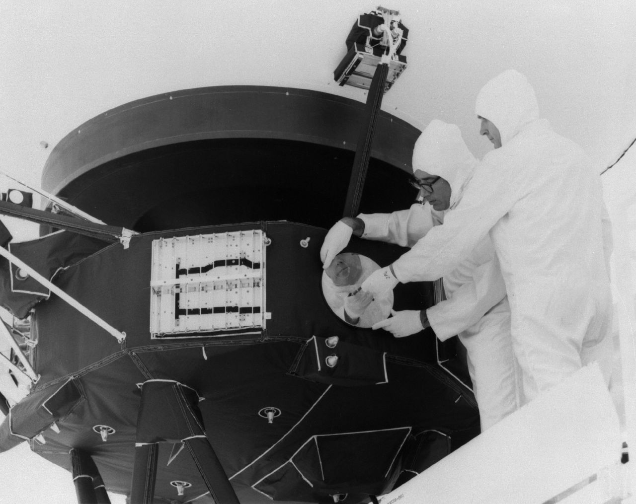 Technicians mounting the Golden Record on a Voyager spacecraft
