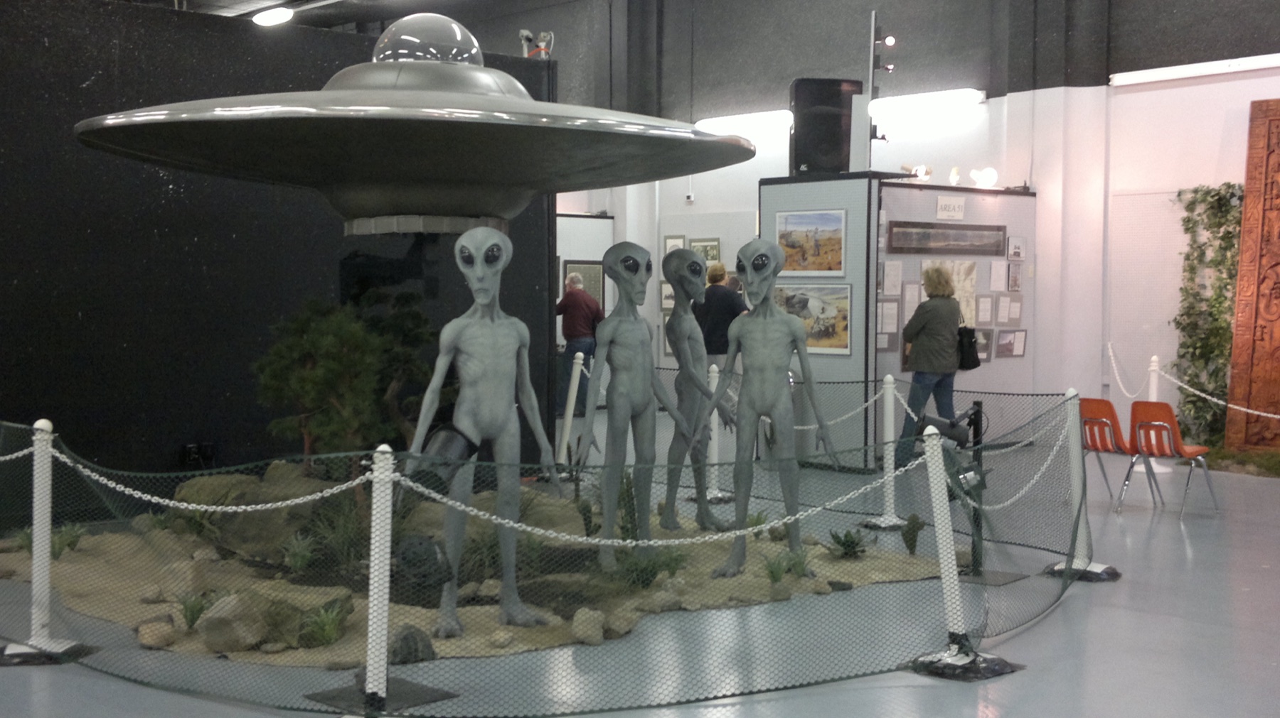 Sculptures of small grey aliens in a Roswell UFO Museum exhibit